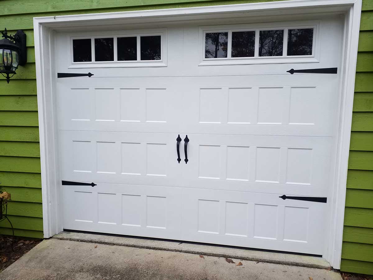White garage door with decorative hinges and handles White garage door with decorative hinges and handles